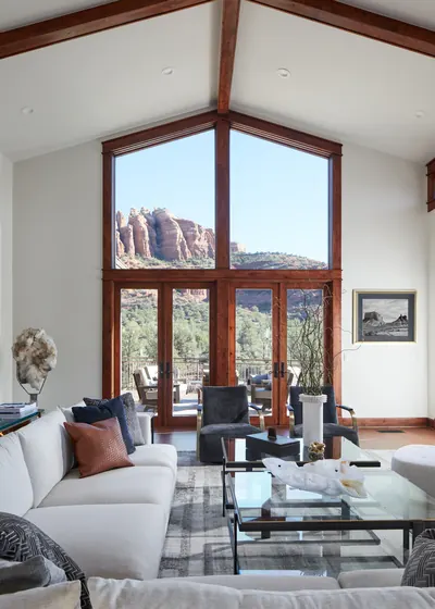 Sedona living room with an all-wool Organic Looms rug and tall windows framing red rock views